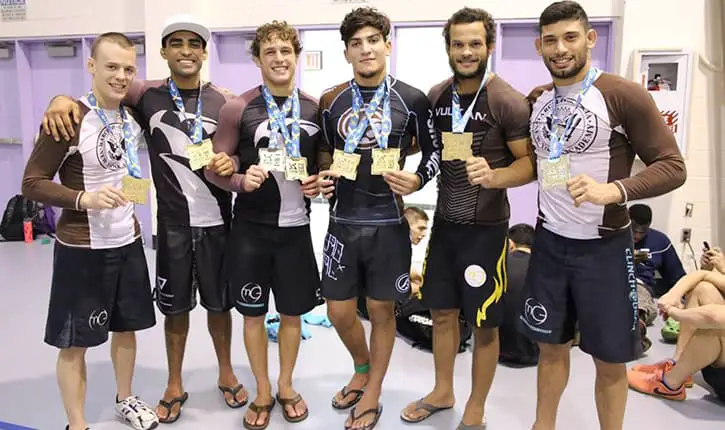 Some BJJ players posing with their medals.