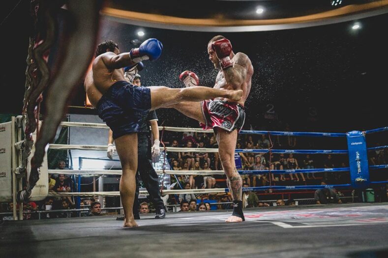 Muay Thai fighters inside a ring Thailand.