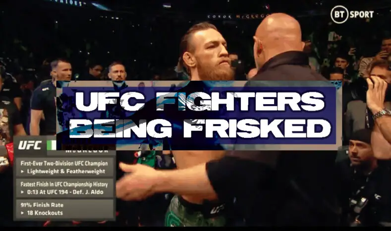 Conor McGregor is frisked by a UFC official.