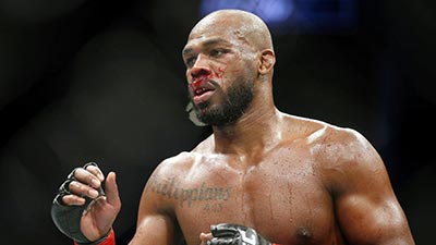 Jon Jones with bloodied nose in the octagon.