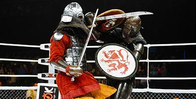 Two fighters competing in medieval MMA as part of Global M-1 MMA..