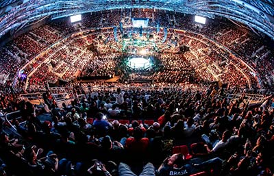 An arena is full of fans watching a live UFC pay per view event.